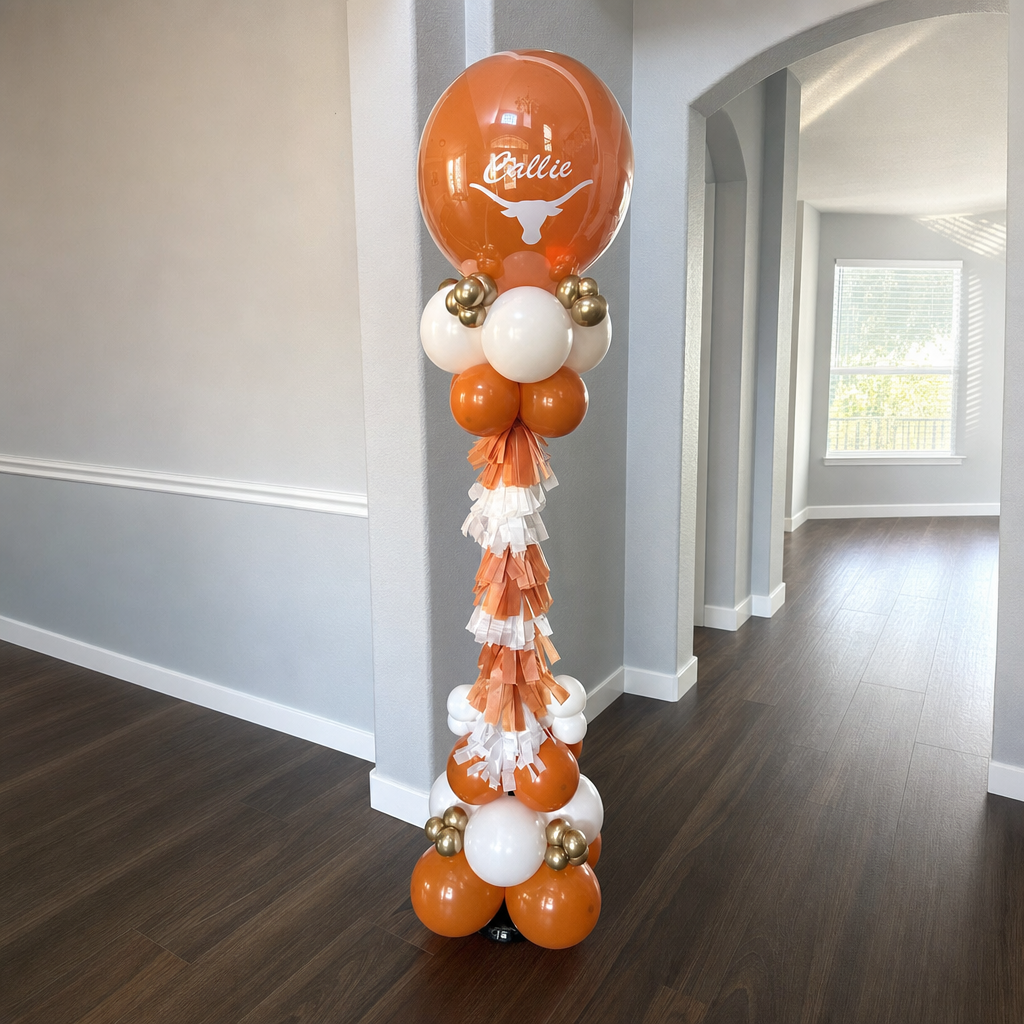 Burnt orange Longhorn themed balloon column with tassel