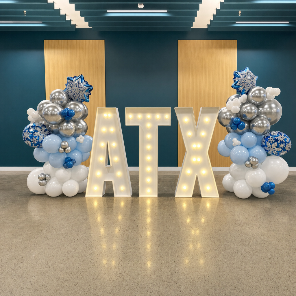 Silver and blue snowflake balloon column by marquee numbers