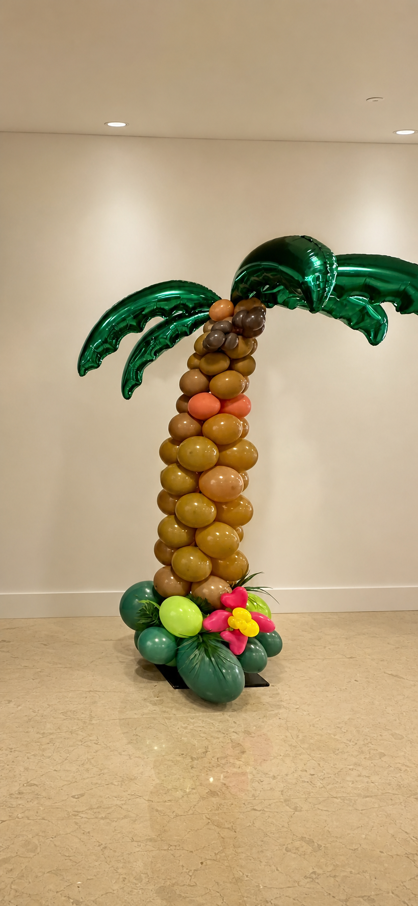 Tropical palm tree balloon design in a corporate lobby